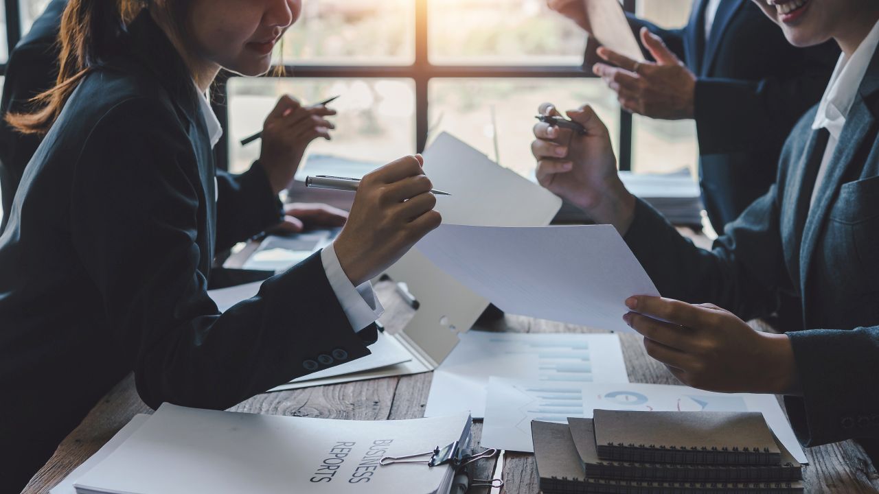 Business Team Discussing Legal Strategy and Risk Assessment Legal strategy, business meeting, trademark disputes, corporate law, risk management