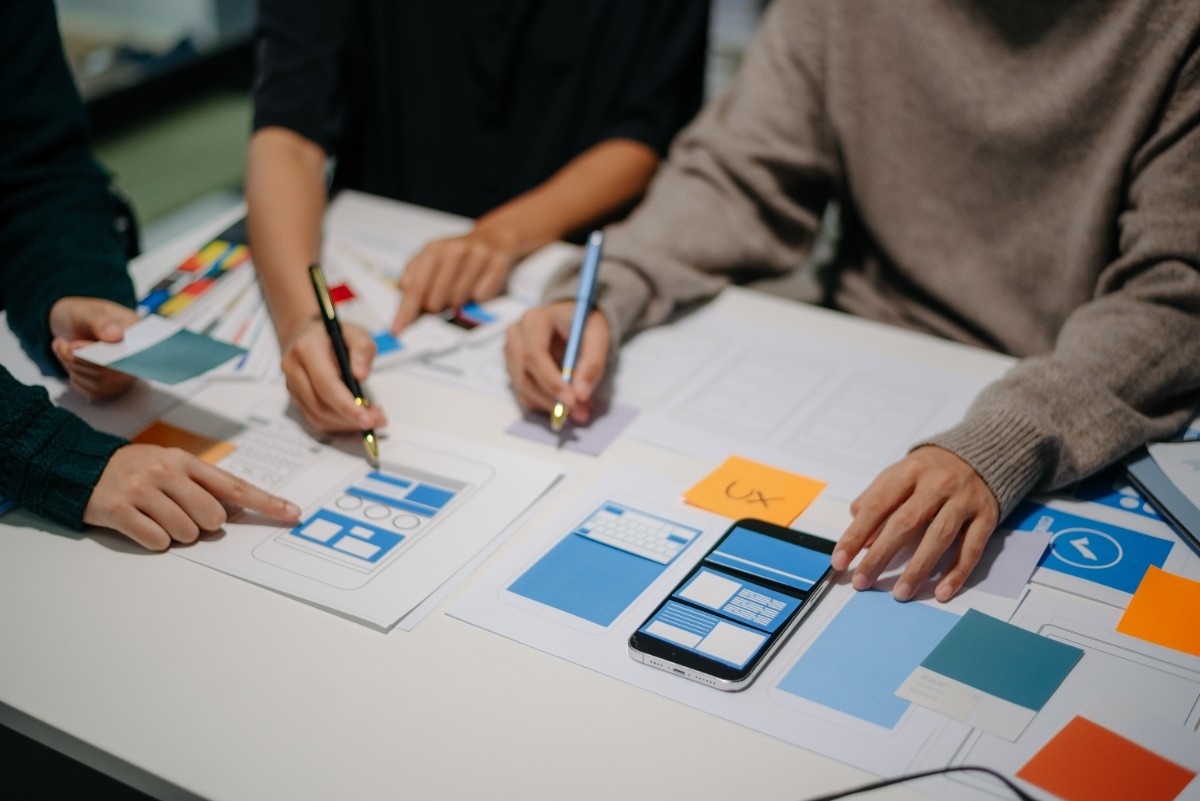 Development team collaborating on mobile design strategy and planning